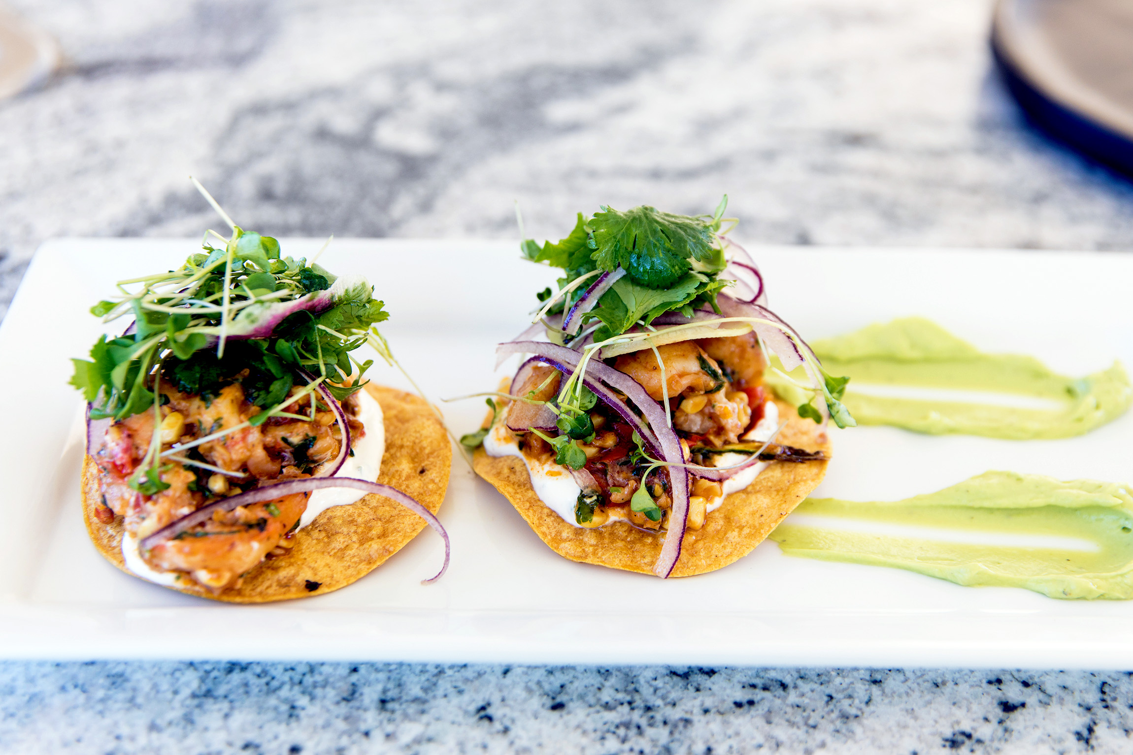 two tostadas on a plate